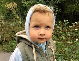 Beautiful baby boy with child face posing photographer photo