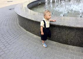 Beautiful baby boy with child face posing photographer photo