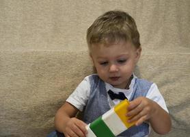 Beautiful baby boy with child face posing photographer photo