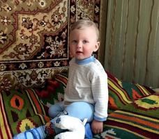 Beautiful baby boy with child face posing photographer photo
