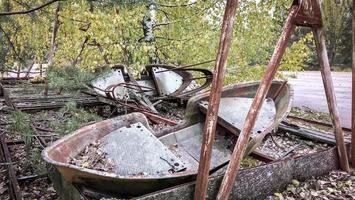 Pripyat, Ukraine, 2021 - Old amusement park rides in Chernobyl photo