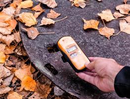 Pripyat, Ukraine, 2021 - Dosimeter measuring radioactive iron in Chernobyl photo