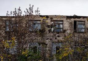 Pripyat, Ukraine, 2021 - Abandoned building among the trees in Chernobyl photo