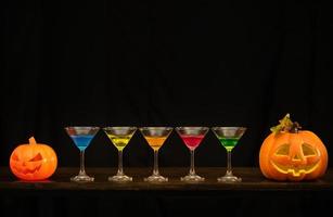 Halloween pumpkin and wine glass photo