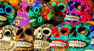 CABO SAN LUCAS, MEXICO, AUGUST 8, 2014 - Calacas, wooden skull Day of the Dead masks on market in Cabo San Lucas, Mexico. Masks are typical symbols representing calacas - skeletons. photo