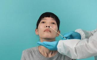 RT PCR test. woman with Covid 19 swab test. photo