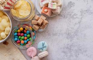 unhealthy food burgers, french fries and sweets top view flat lay with copy space photo