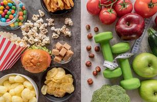 Fruit and vegetables vs sweets and potato fries top view flat lay photo