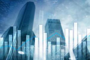 Financial graphs and charts on blurred business center background. Invesment and trading concept photo