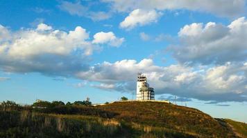 Ship control building on the background of the sky with clouds photo