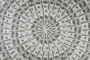 Group of money stack of 100 US dollars banknotes a lot of is arranged in a beautiful circle photo
