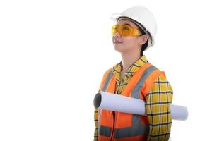 Portrait beautiful young Asia woman civil engineer holding plan drawing  looking forward and thinking of a white background, Planning on construction building concept photo