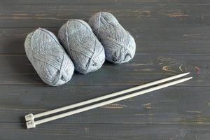 Blue knitting wool and knitting needles.