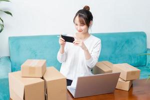 Asian woman portrait at home and online business photo