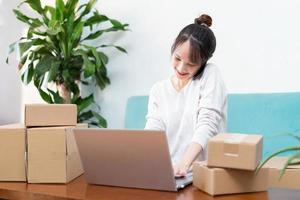 Asian woman portrait at home and online business photo