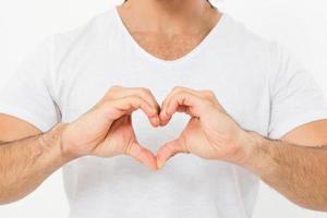 man shows a heart-shaped gesture close-up. love theme.Top view. Mock up. Copy space. Template. Blank. photo