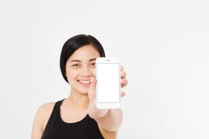 Smiling asian japanese woman hold white smartphone or cellphone isolated on white background texture.advertising concept. Positive face expression human emotion. Copy space. photo