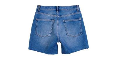 Denim shorts close up. Blue jean shorts with a white background. Women jeans shorts isolated on white background photo