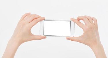 Smartphone horizontal in hand, bezel less modern design white version photo