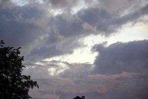 Sky with thunderclouds. Crimson sunset. photo