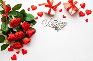 Red roses and gift boxes photo