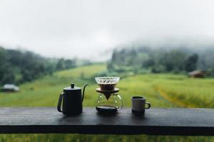 drip coffee maker on wooden table photo