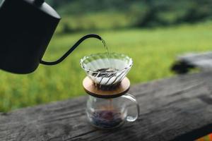 drip coffee maker on wooden table photo