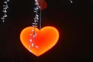 New Year's garland of hearts with illumination at night photo