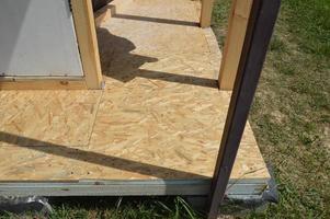 Construction of the vestibule of the veranda of racks and beams photo