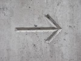 arrow on concrete photo