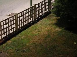 fence between road and lawn photo