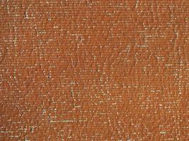 Fondo de textura de cuero sintético marrón desgastado foto