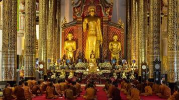 Time-lapse. Buddhist monks praying in the church in Thailand. 4K video