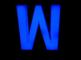 blue neon letter W photo