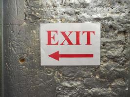 exit sign with direction arrow