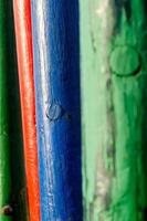 green and red and blue wooden painted logs photo