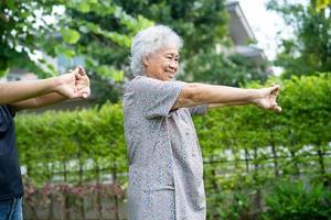 Asian senior or elderly old lady woman patient exercise with happy fresh enjoy in park, healthy strong medical concept photo