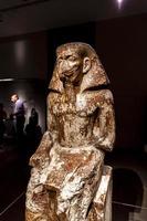 TURIN, ITALY, JUNE 3, 2015 - Statue of governor Wakha, son of Neferhotep in Museo Egizio in Turin, Italy. Museum houses one of largest collections of Egyptian antiquities more than 30,000 artefacts. photo