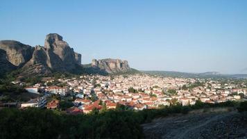 View of Kalambaka city, Greece, with Meteora mountains as background photo