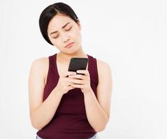 sad korean,asian woman look on phone isolated on white background,copy space,mock up photo