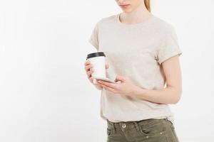 Girl holding white phone.Plastic cup of coffee. Cellular isolated on white clipping path inside. Top view.Mock up.Copy space.Template.Blank. photo