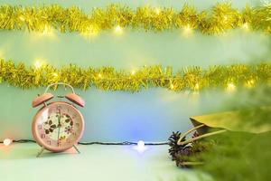 Minimalist concept idea displaying products. christmas and new year backgrounds. alarm clock. pine flower photo