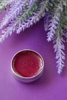 purple color petroleum jelly in a container photo