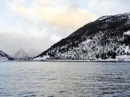 Winter landscape fjord sunrise sunset, Norway. Ferry Vangsnes to Balestrand. photo