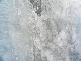 Textura macro foto de cascada congelada azul turquesa en Noruega.