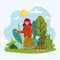 niña con plantas en el jardín vector