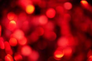 Defocus light red christmas color. Glitter background, new year. photo