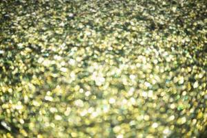 Defocus light golden christmas color. Glitter background, new year. photo