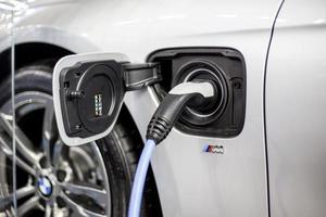 BELGRADE, SERBIA, MARCH 28, 2017 - Recharging of hybrid BMW car. BMW ActiveHybrid technology unites a combustion engine and electric drive photo