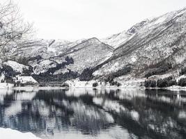 Winter landscape at the frozen fjord lake river, Framfjorden Norway. photo